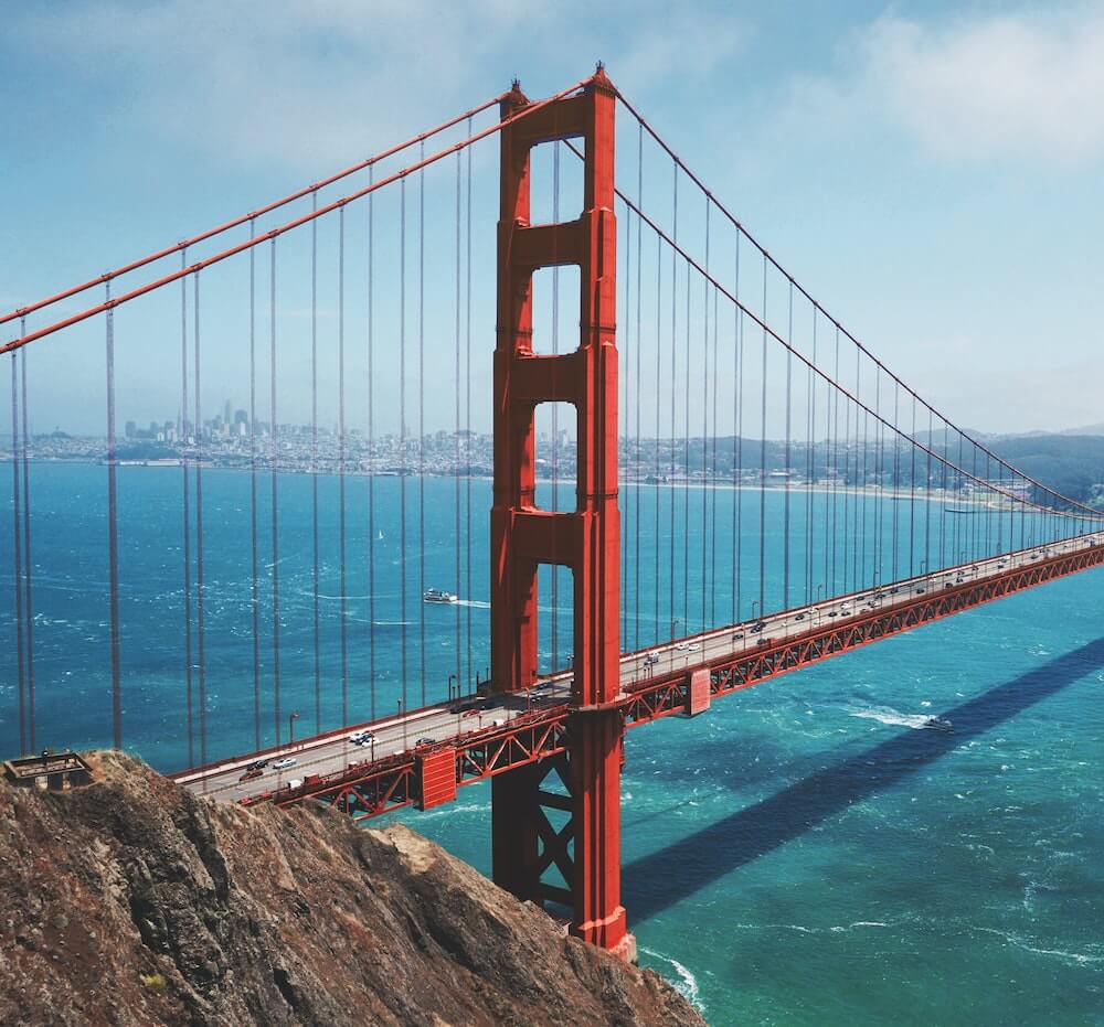 Golden Gate Bridge spanning San Francisco Bay with city skyline