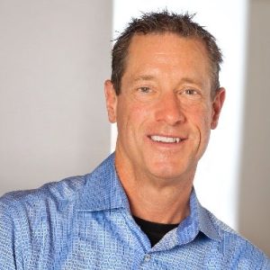 David Meerman Scott, digital marketing expert, smiling in blue shirt