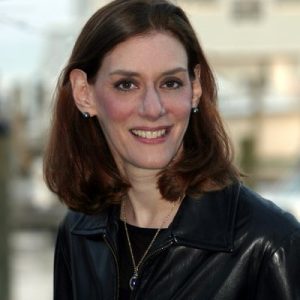 Heidi Cohen smiling at camera wearing black leather jacket