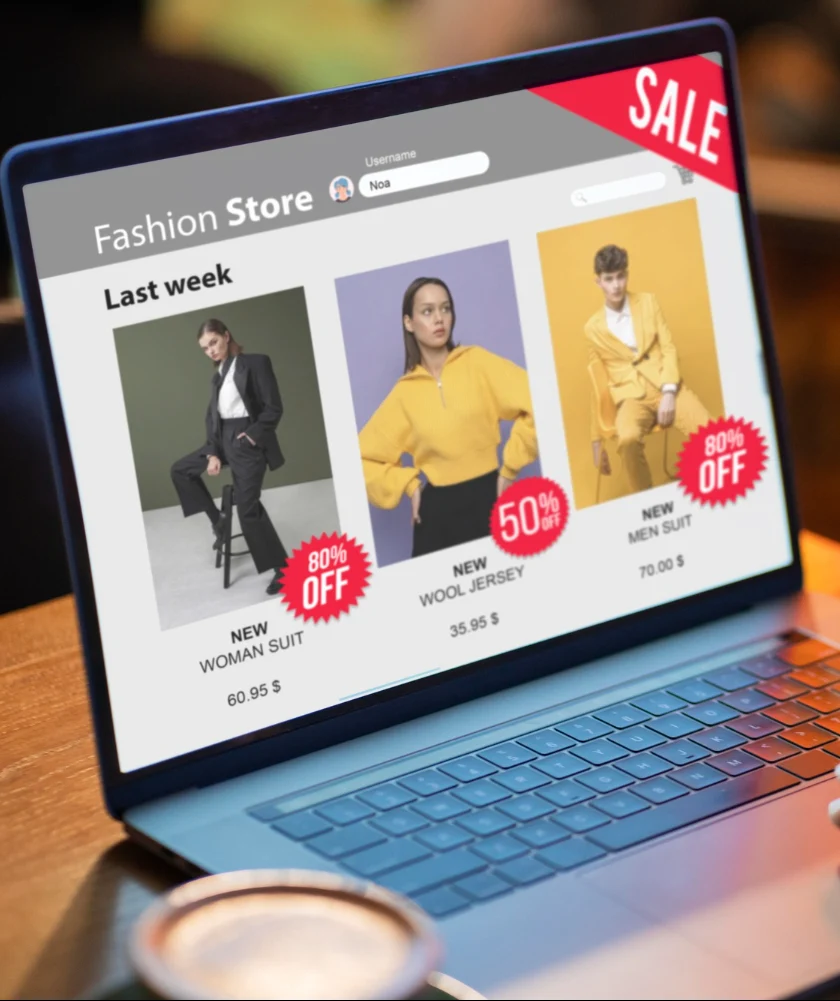 Fashion store website displaying sale items with up to 80% off discounts on clothing