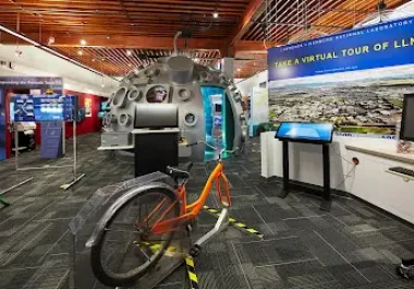 Lawrence Livermore National Lab Discovery Center with orange bike and virtual tour display