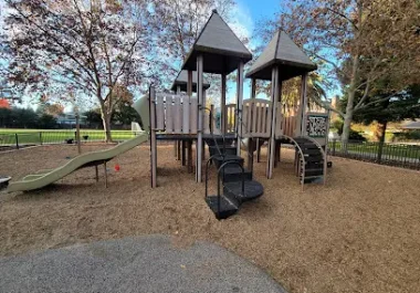 Playground equipment with twin towers and slides at Jack W. Lyle Park in Menlo Park