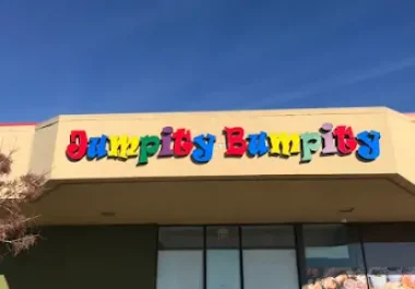 Jumpity Bumpity storefront in Fairfield with colorful sign and blue sky