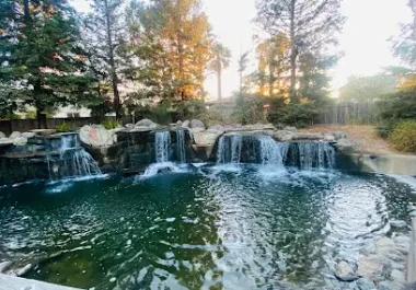 Scenic waterfall and pond at Lawler Falls Park in Fairfield surrounded by trees