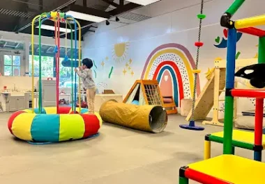 Colorful indoor play equipment and climbing structures at children's activity facility