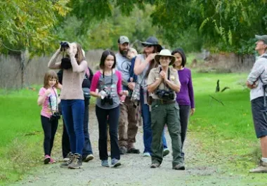 Group of people enjoying outdoor nature walk at Sycamore Grove Park in Livermore