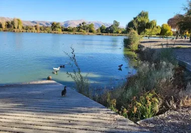 Scenic lake with wooden dock at Central Park in Fremont, California