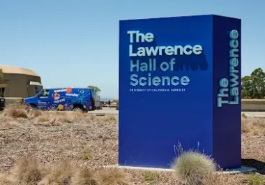 The Lawrence Hall of Science entrance sign in Berkeley with blue architectural structure