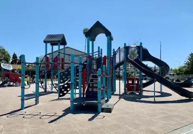 Colorful playground equipment with slides and climbing structures in Fremont park