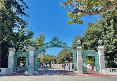 Sather Gate entrance at UC Berkeley campus with ornate archway and surrounding trees