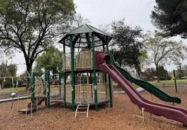 Children's playground tower with slide in Concord park setting